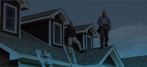 man on a roof performing inspection