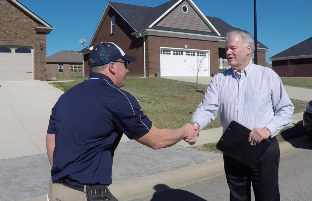 homeowner shaking hands with inspector